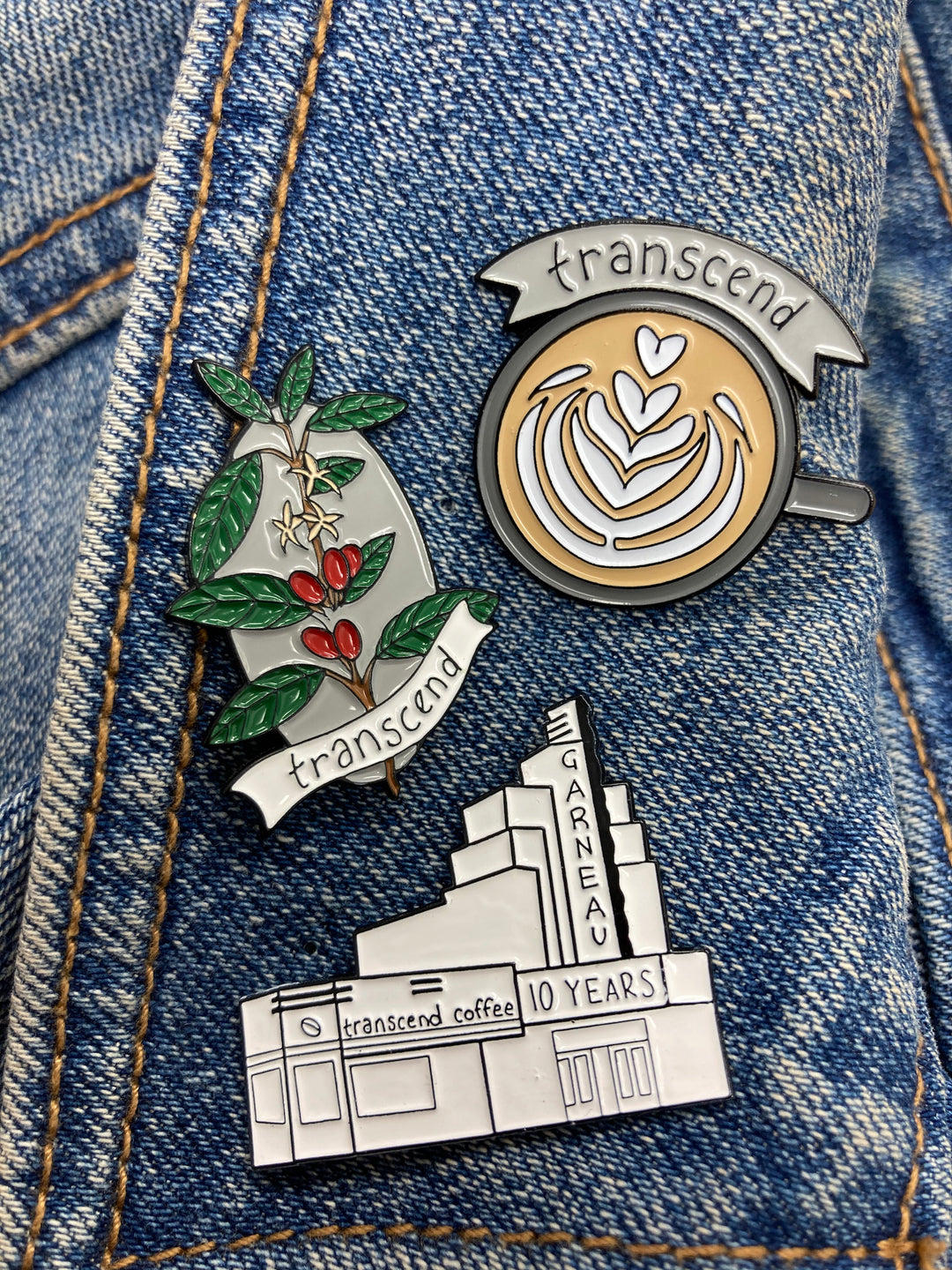 Transcend enamel pins